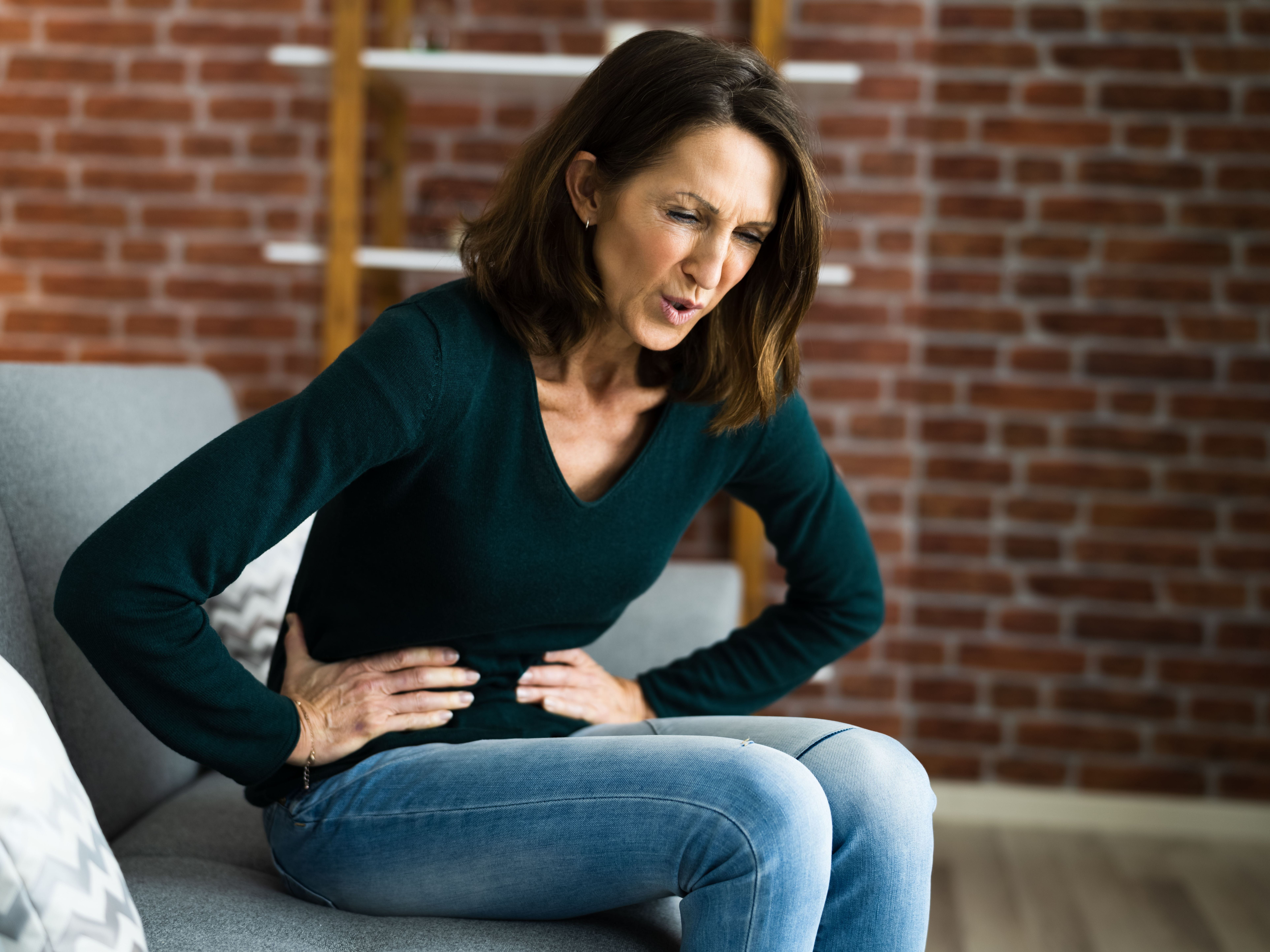 woman experiencing stomachache 