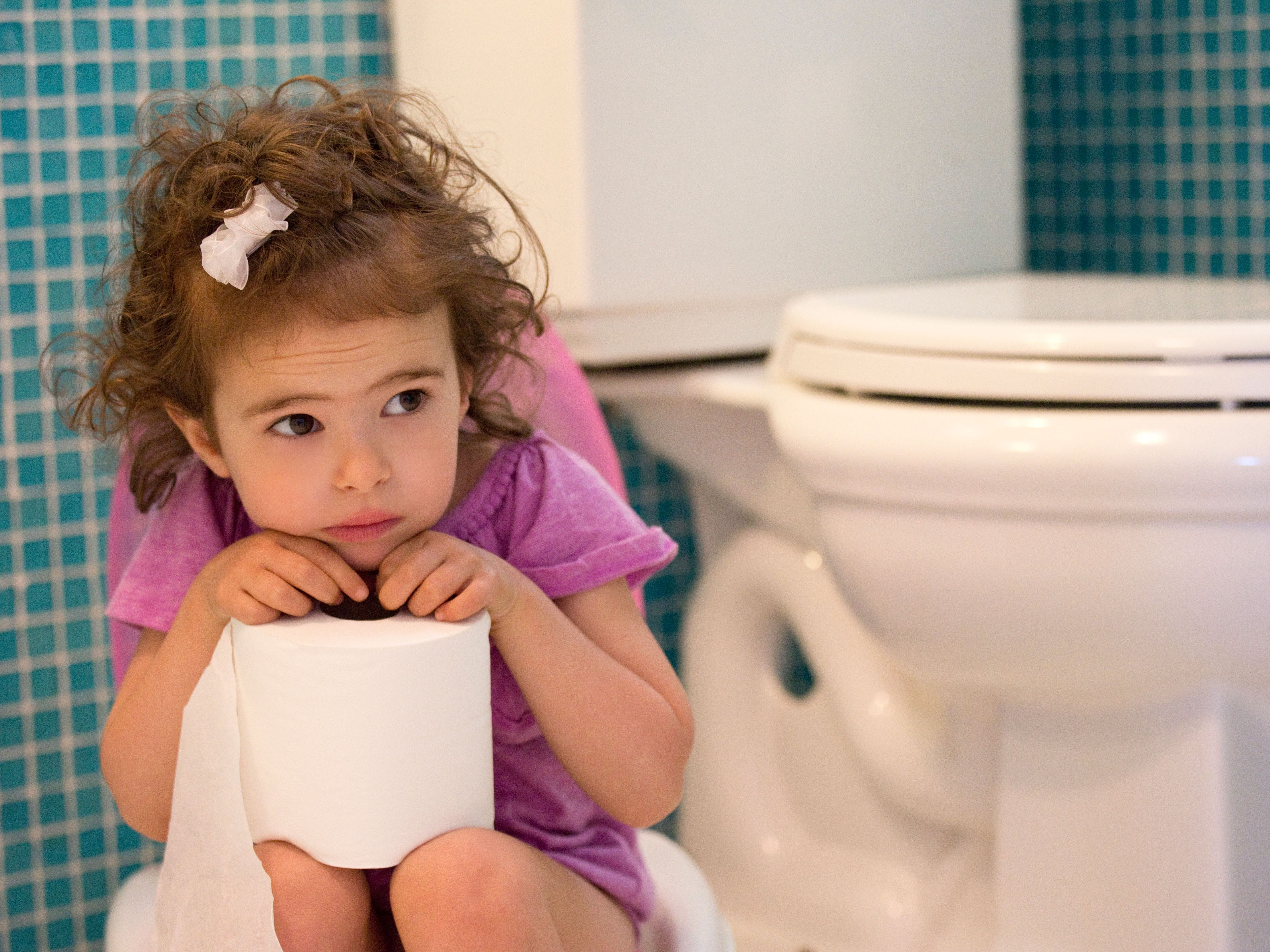 girl clutching toilet paper