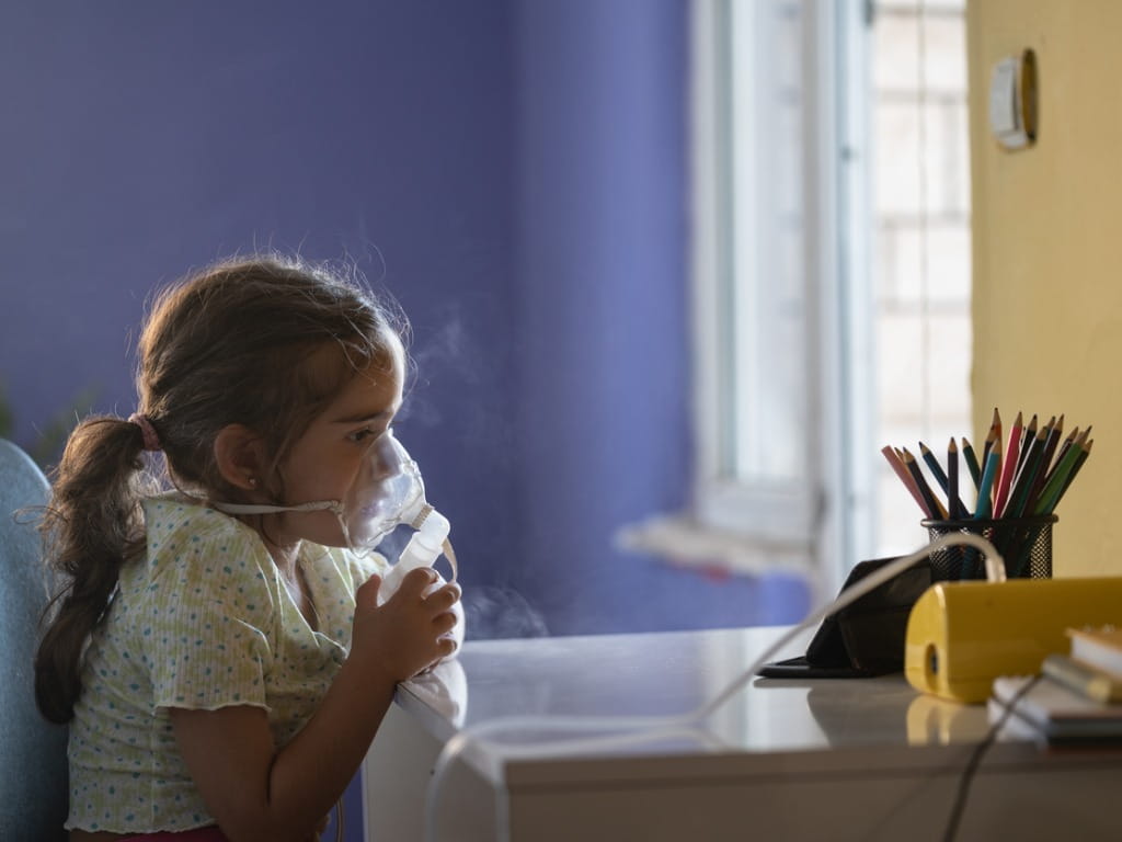 child using a nebulizer